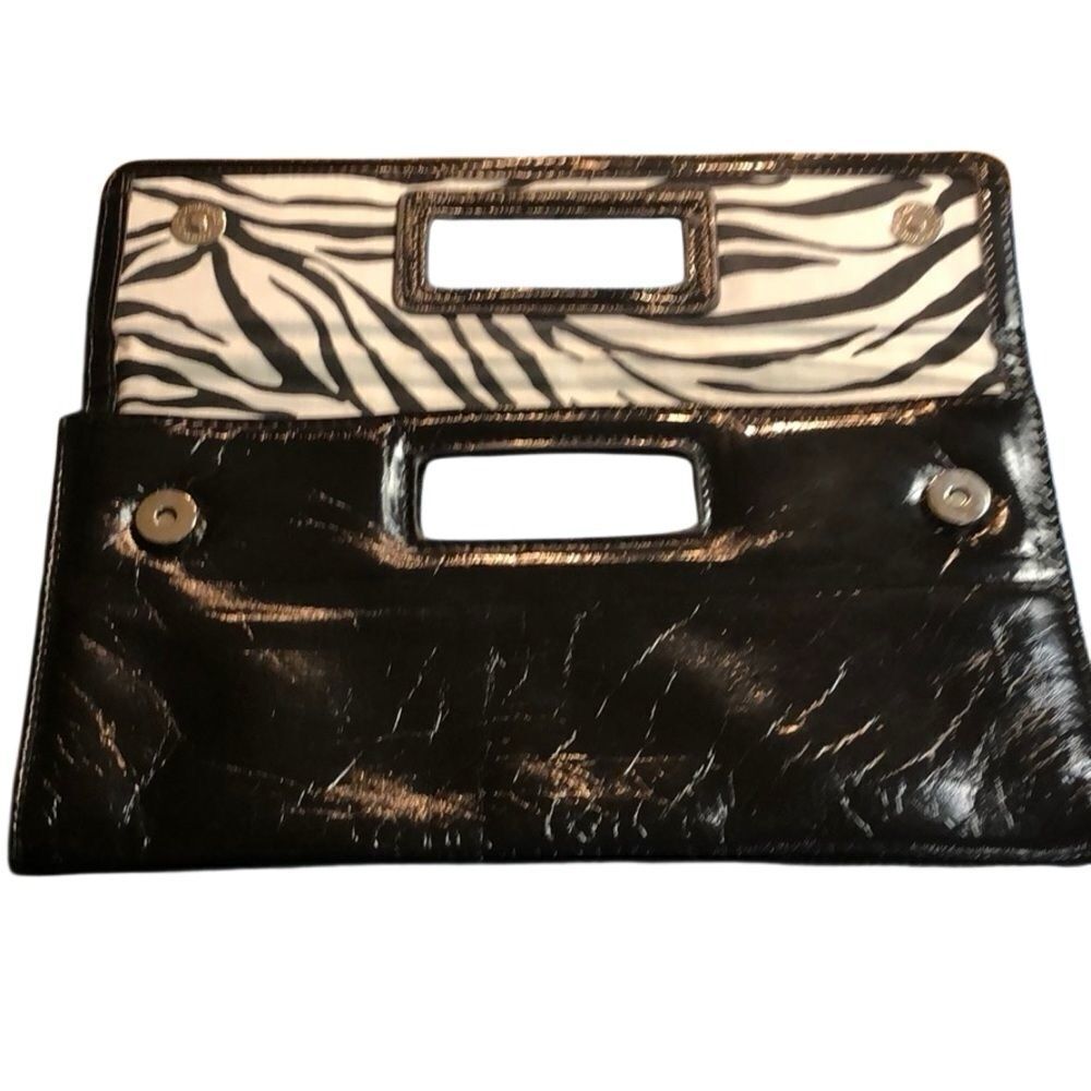 Gap black shiny clutch with zebra print inside